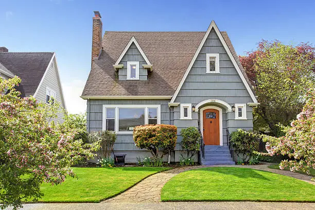 Home exterior in gray with contrasting white trim by a house painter in Kansas City, MO.