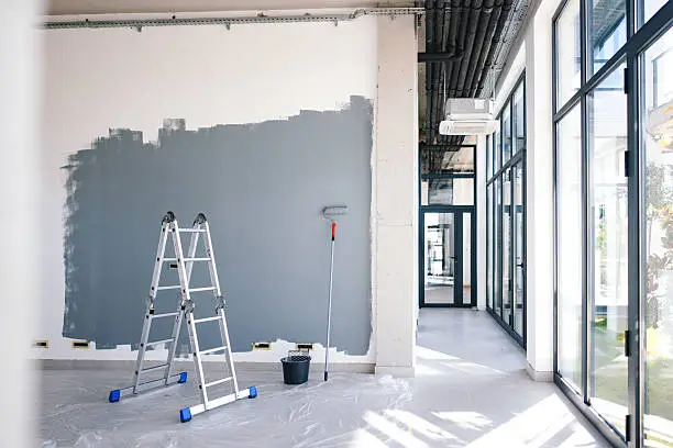 Commercial interior painting in progress with gray wall color by a commercial painter in Kansas City, MO.