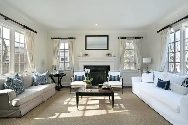 Living room with soft neutral wall colors and crisp white trim by an interior painter in Kansas City, MO